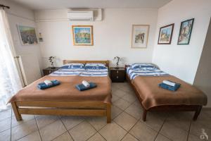 Postel nebo postele na pokoji v ubytování Villa Goga