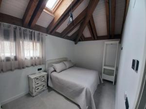 Tempat tidur dalam kamar di Las Pasaeras