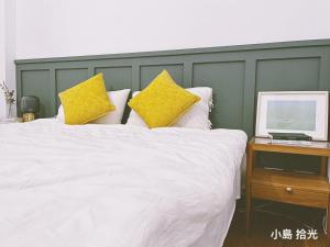 Postel nebo postele na pokoji v ubytování 小島拾光 宜蘭田間包棟民宿Taiwan Yilan Private Villa Paddy view with tranquil & chill vibes