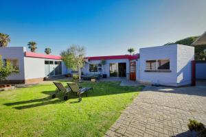 a house with a lawn in front of it at Coastal Soul no 1 in Swakopmund
