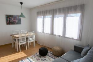 a living room with a couch and a table at La Pedriza One in Manzanares el Real
