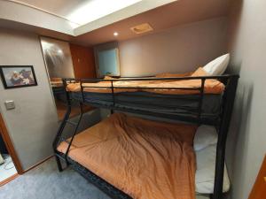 Ένα ή περισσότερα κρεβάτια σε δωμάτιο στο Dalgona Guesthouse