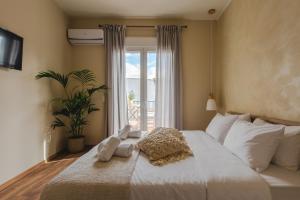 Postel nebo postele na pokoji v ubytování Living Stone Aparthotel