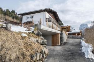 a house on the side of a mountain at Apartment Sciadules in Ortisei