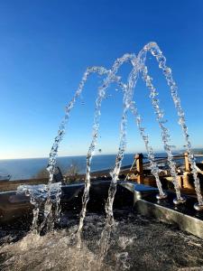 a fountain with water spraying into the air at Chesil View in Castletown