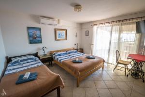 Postel nebo postele na pokoji v ubytování Villa Goga