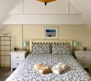 a bedroom with a large bed with two night stands at Streamside B and B with Parking in Drom dhá Liag