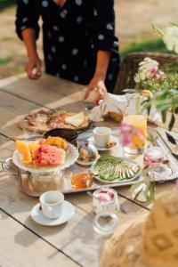 a table topped with plates of food and drinks at Buonvisi B&B in Lucca