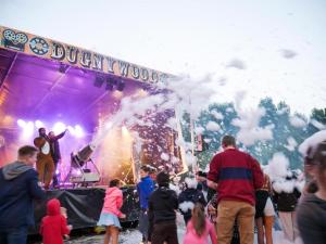 a crowd of people standing in front of a stage at Camping 4* 3 CH 2 SDB- Lave linge- Lave vaisselle in Onzain