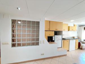 Η κουζίνα ή μικρή κουζίνα στο Apartament MACABEU CIM apartaments +5 φωτογραφίες