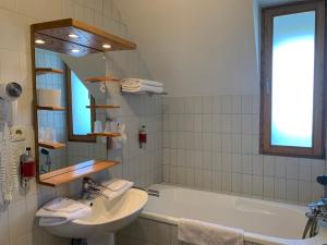 Koupelna v ubytování Auberge de Poteaupré