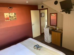 Postel nebo postele na pokoji v ubytování Auberge de Poteaupré
