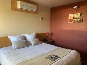 Postel nebo postele na pokoji v ubytování Auberge de Poteaupré