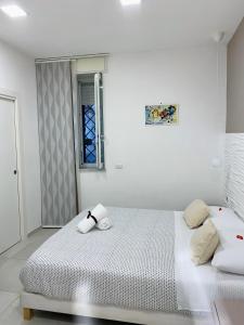 Posteľ alebo postele v izbe v ubytovaní Appartamento I Cenni di Napoli