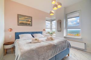 Posteľ alebo postele v izbe v ubytovaní Apartamenty Onyx SeaView by Rent like home
