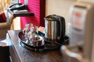 Set per la preparazione di tè e caffè presso Hotel Krebs Interlaken