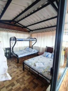 Cama o camas de una habitación en Hospedaje Villa de piedra