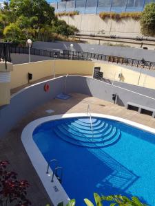 Výhled na bazén z ubytování Apartamento Olaya nebo okolí