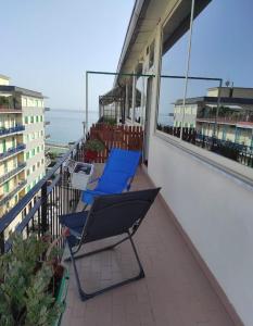 two chairs on a balcony with the ocean in the background at Alta Quota Central on the Sea in Salerno