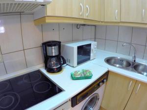 Kuchyňa alebo kuchynka v ubytovaní ConilPlus apartments AZORIN II