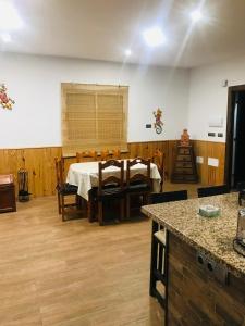 a room with a table and chairs in it at La Belleza de Rodalquilar in Rodalquilar +22 photos