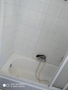 a bath tub with a faucet in a bathroom at Hostal padornelo in Mondoñedo