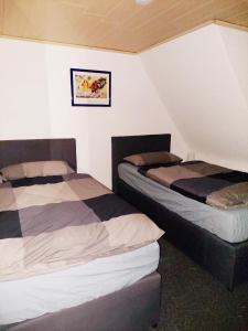 Katil atau katil-katil dalam bilik di Ferienwohnung Haske mit Wallbox