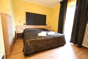 A bed or beds in a room at Suite - La Casa del Maestro