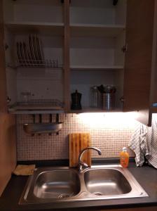 a kitchen counter with a sink in a kitchen at Roma - Talenti in Rome