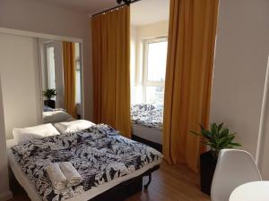 Posteľ alebo postele v izbe v ubytovaní Apartament blisko morza i stadionu Polsat Plus Arena Gdańsk