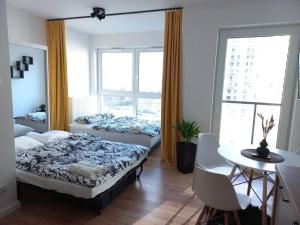 Posteľ alebo postele v izbe v ubytovaní Apartament blisko morza i stadionu Polsat Plus Arena Gdańsk + 1 fotografia