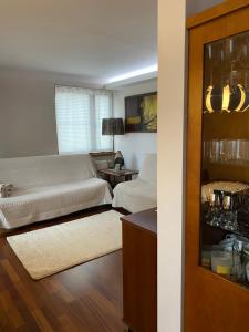 a living room with a couch and a table at APARTAMENT LUCYNA in Rabka-Zdrój