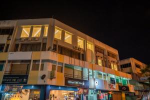 a building with a lot of windows at night at AC Residence - Behind Cititel Hotel in Kota Kinabalu