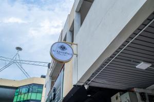 a sign on the side of a building at AC Residence - Behind Cititel Hotel in Kota Kinabalu