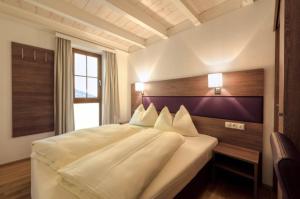 Postel nebo postele na pokoji v ubytování Aigenberg Appartements