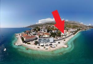 an aerial view of an island with a red arrow at Sea La Vie in Dugi Rat