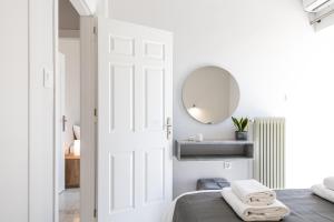 Posteľ alebo postele v izbe v ubytovaní West City Apartment