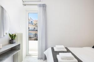 Posteľ alebo postele v izbe v ubytovaní West City Apartment
