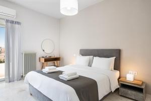 Posteľ alebo postele v izbe v ubytovaní West City Apartment