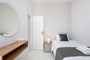 Posteľ alebo postele v izbe v ubytovaní West City Apartment