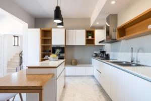 Kuchyňa alebo kuchynka v ubytovaní West City Apartment