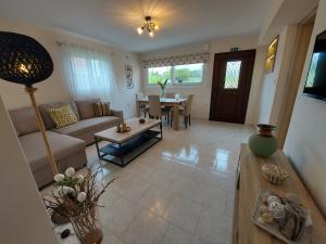 a living room with a couch and a table at Mandola suite in Argostoli