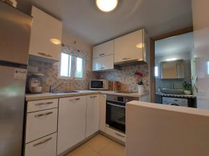 A kitchen or kitchenette at Mandola suite