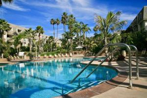 a swimming pool with a slide in a resort at B306 - Endless Summer in Oceanside