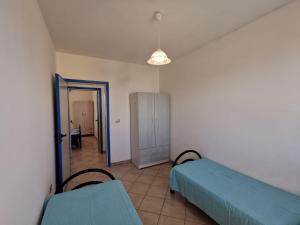 A bed or beds in a room at Appartamento Ghirigoro 2
