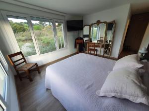 Ένα ή περισσότερα κρεβάτια σε δωμάτιο στο Casa La Pedrera +12 φωτογραφίες