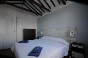 מיטה או מיטות בחדר ב-Casa BuonVento