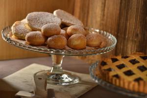 a plate of donuts on top of a table at Hotel Piccolo Mondo in Livigno