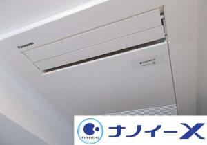 a ceiling light with a sign on it at APA Hotel Yodoyabashi Kitahama Ekimae in Osaka