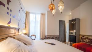 Postel nebo postele na pokoji v ubytování Hotel Madinat